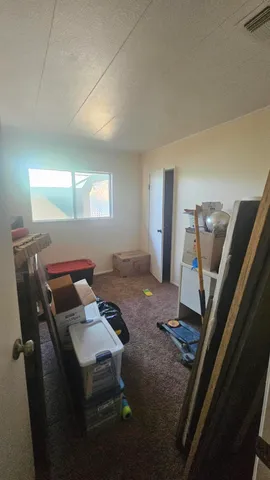 a bedroom with furniture and a gate