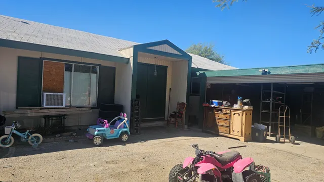 a garage with furniture and a potted plant