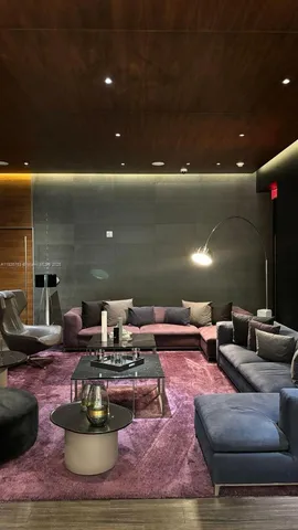 a living room with furniture and a fountain