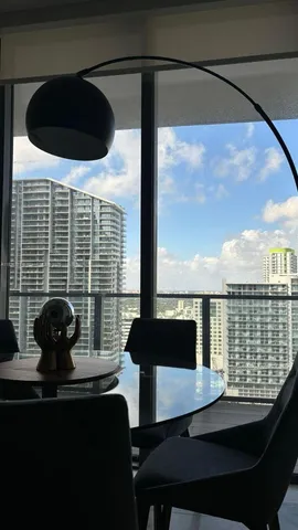 a view of a balcony with a potted plant