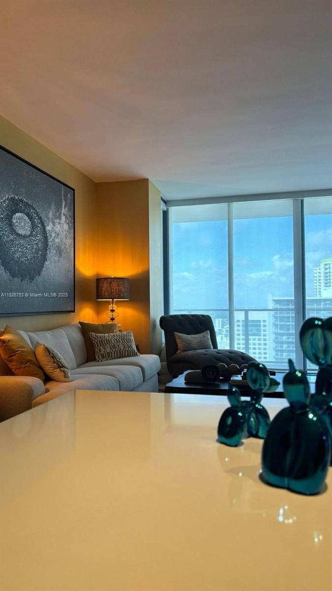 68 Southeast 6th Street, Unit 2804 Miami, FL 33131 - Photo 3 of 41 a living room with furniture