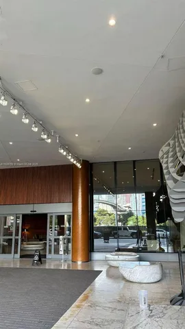 a view of a swimming pool with outdoor seating