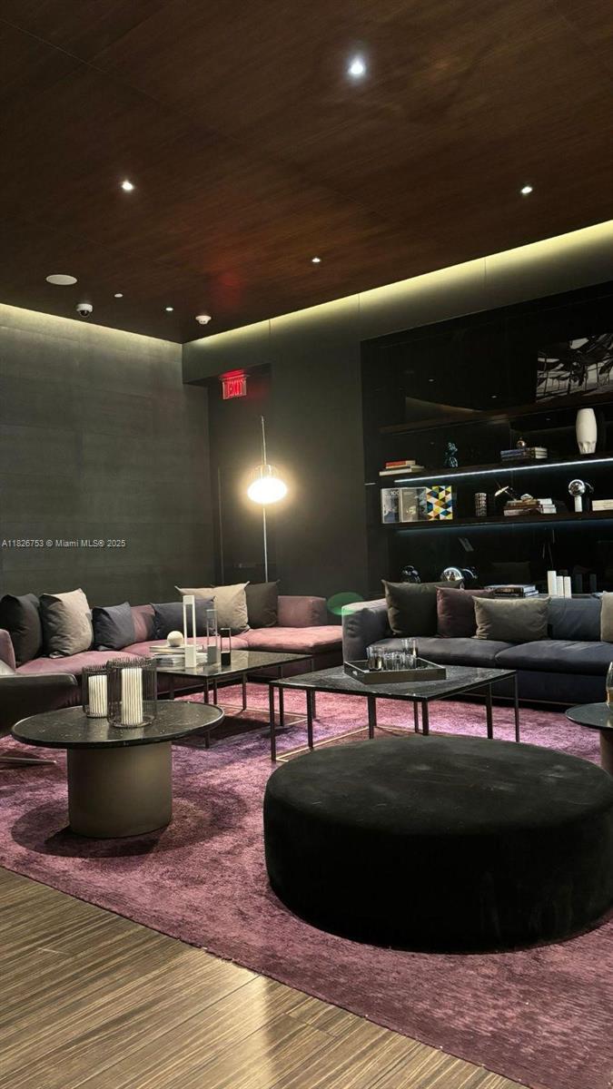 68 Southeast 6th Street, Unit 2804 Miami, FL 33131 - Photo 37 of 41 a living room with stainless steel appliances