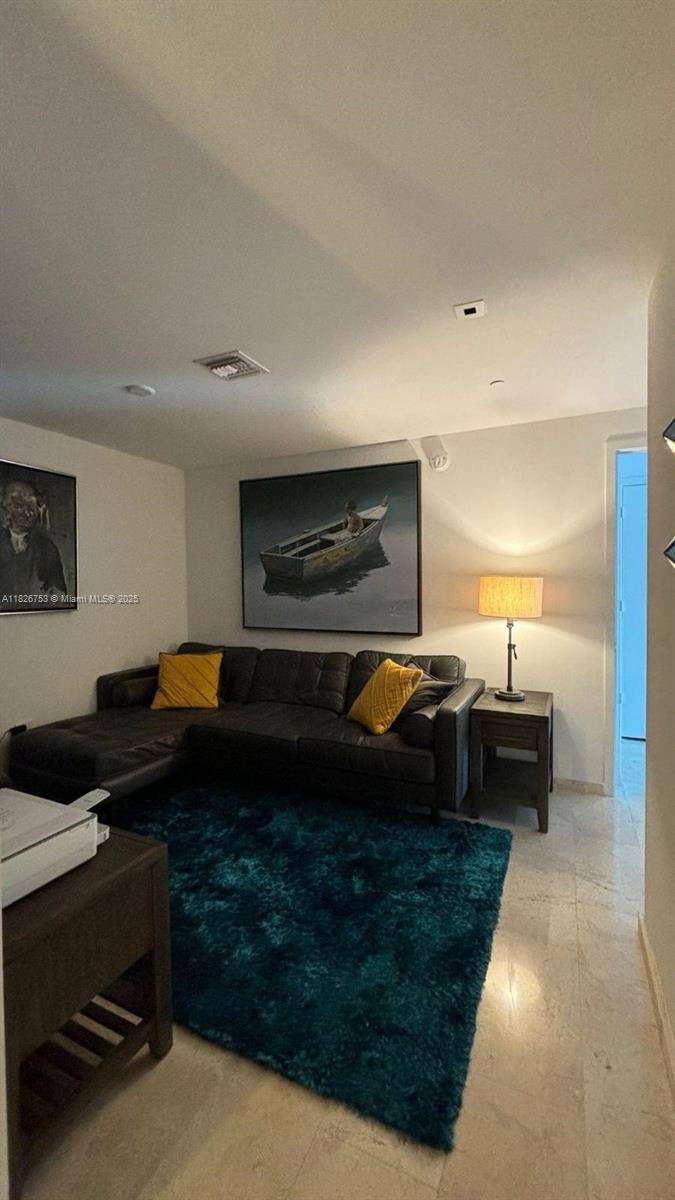68 Southeast 6th Street, Unit 2804 Miami, FL 33131 - Photo 8 of 41 a living room with furniture