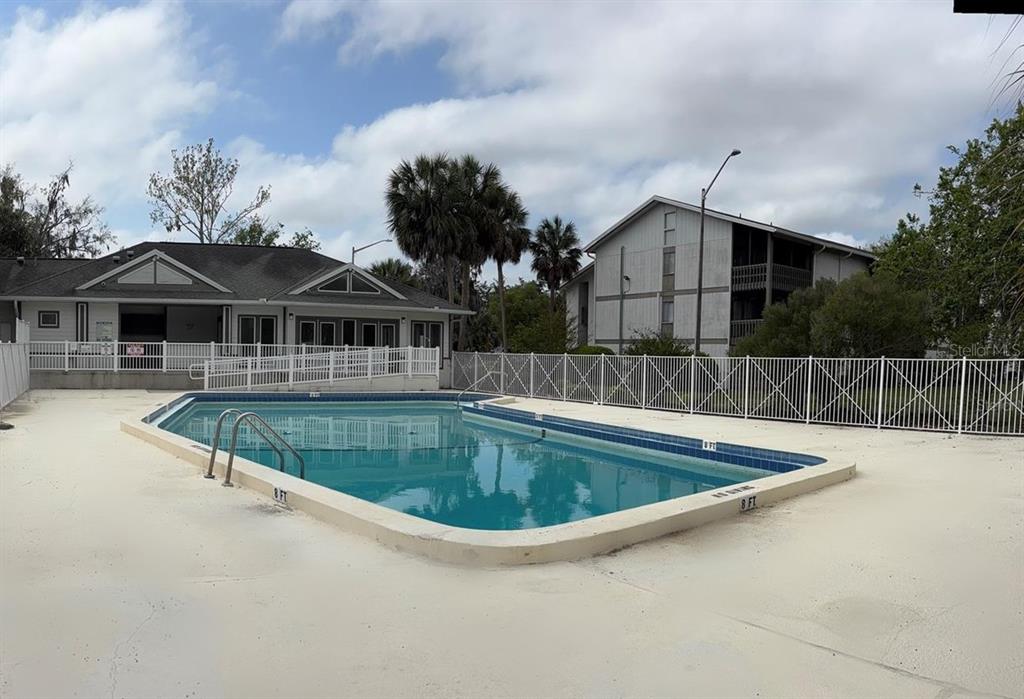 6519 West Newberry Road, Unit 604 Gainesville, FL 32605 - Photo 11 of 13 a view of a house with pool