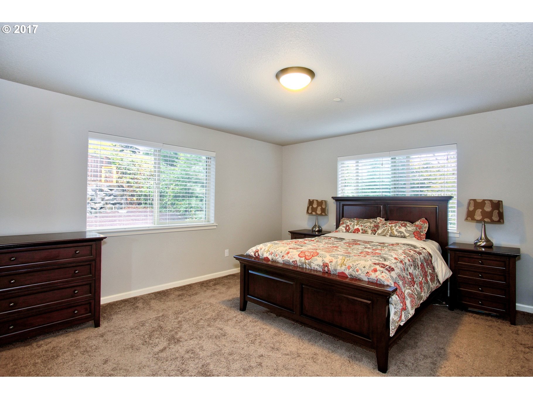12723 Southwest Willow Point Lane Tigard, OR 97224 - Photo 11 of 27 a bedroom with a bed and window