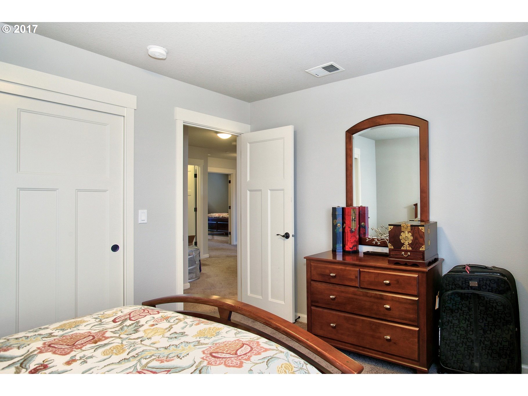 12723 Southwest Willow Point Lane Tigard, OR 97224 - Photo 19 of 27 a bedroom with a dresser and a mirror