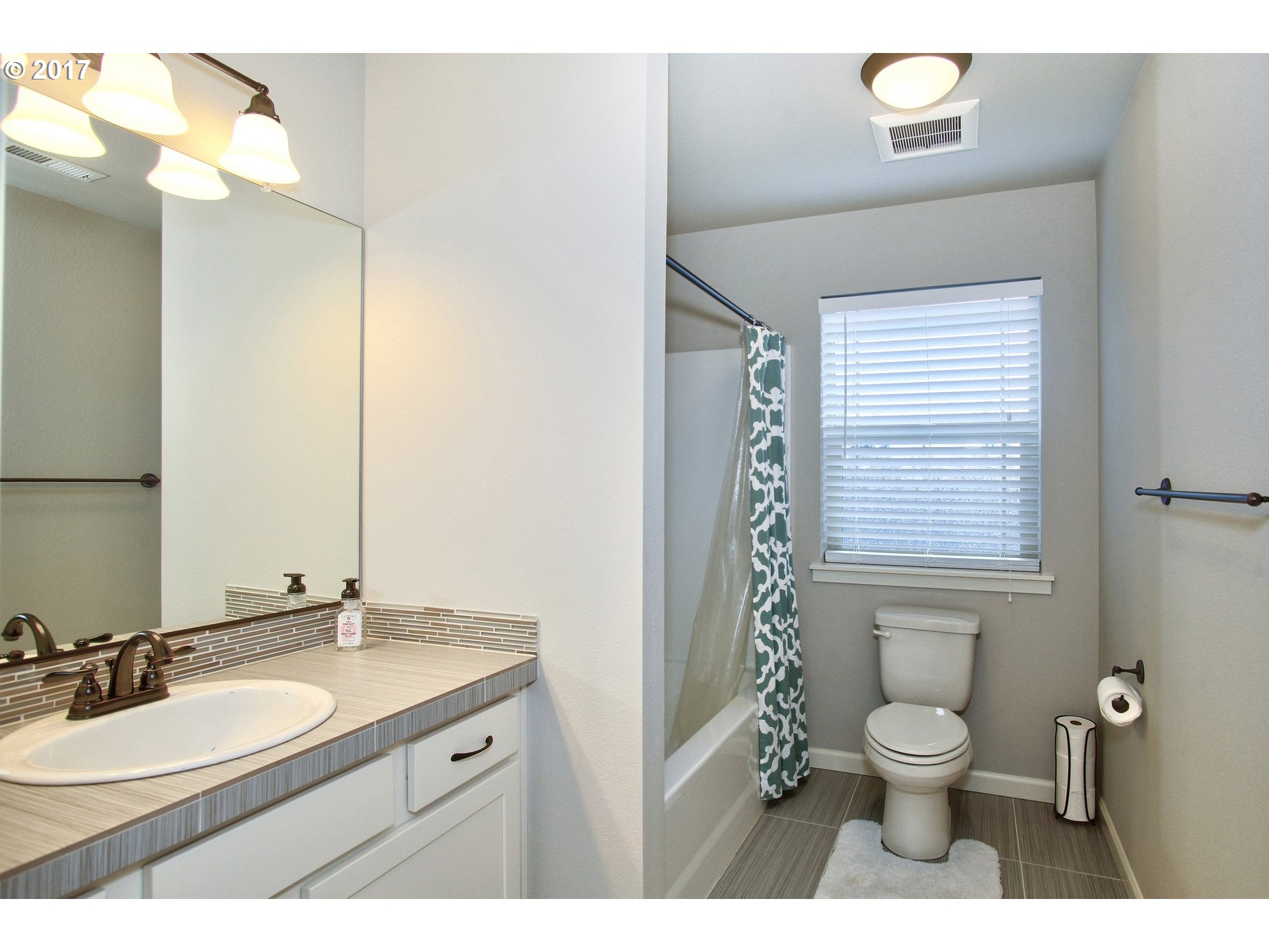 12723 Southwest Willow Point Lane Tigard, OR 97224 - Photo 20 of 27 a bathroom with a granite countertop toilet a sink and a mirror