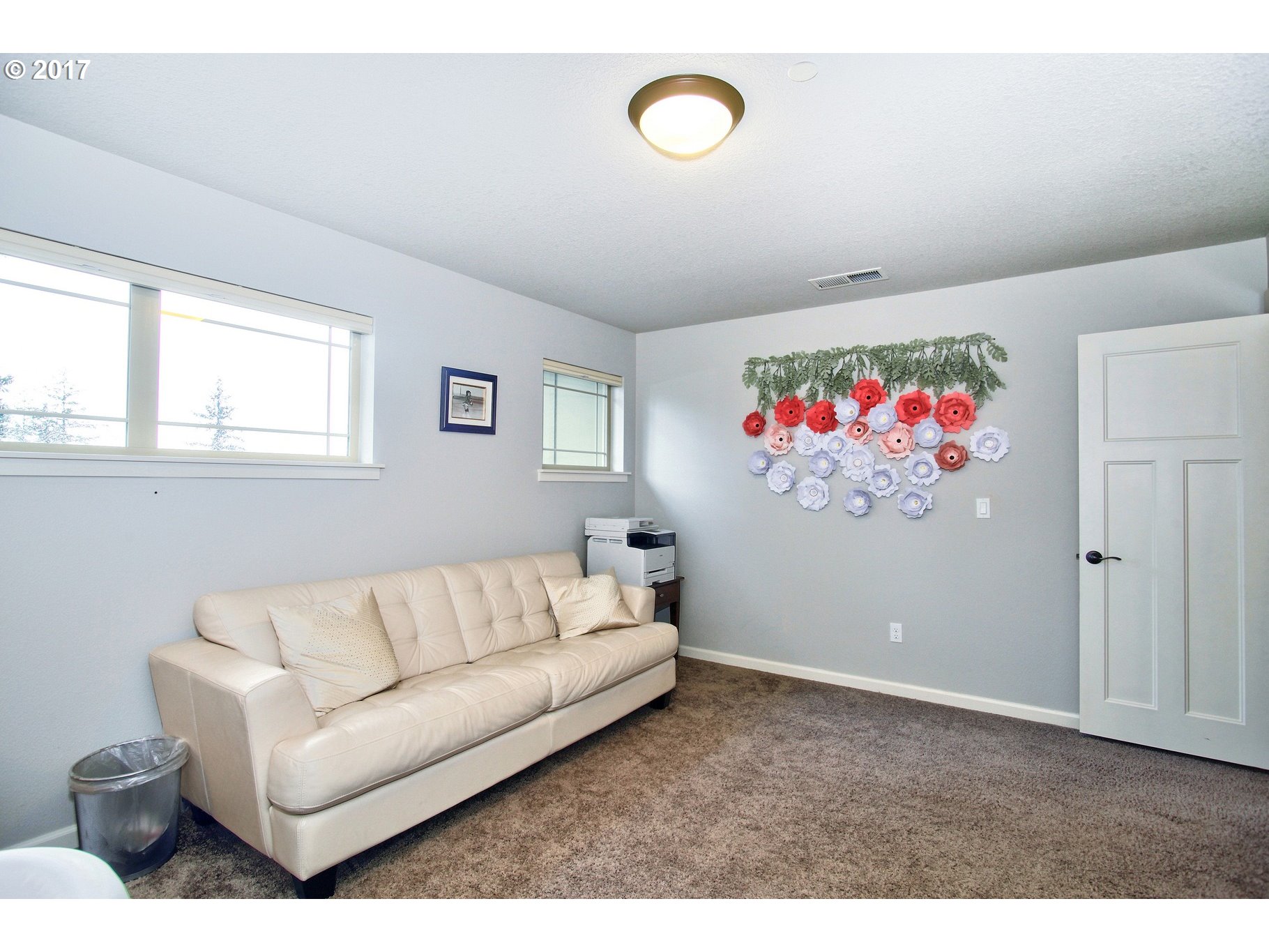 12723 Southwest Willow Point Lane Tigard, OR 97224 - Photo 24 of 27 a living room with furniture and wall paintings