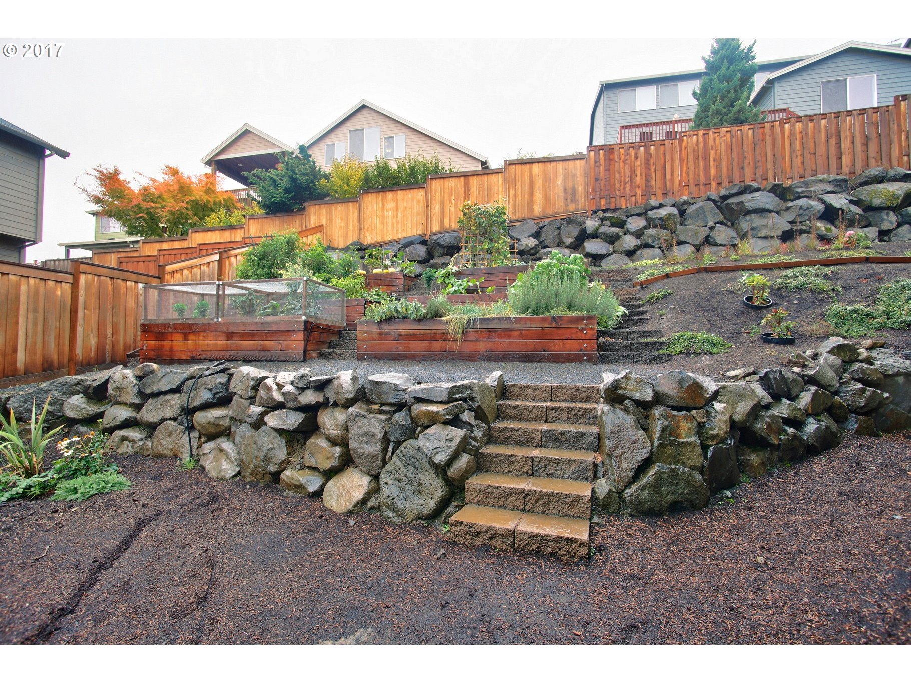 12723 Southwest Willow Point Lane Tigard, OR 97224 - Photo 26 of 27 a view of a backyard with plants and a patio