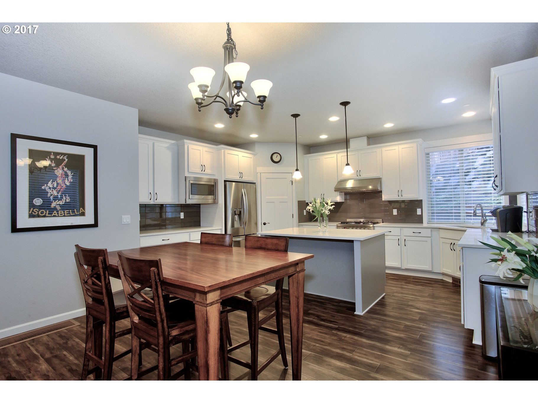 12723 Southwest Willow Point Lane Tigard, OR 97224 - Photo 5 of 27 a large kitchen with a table and chairs