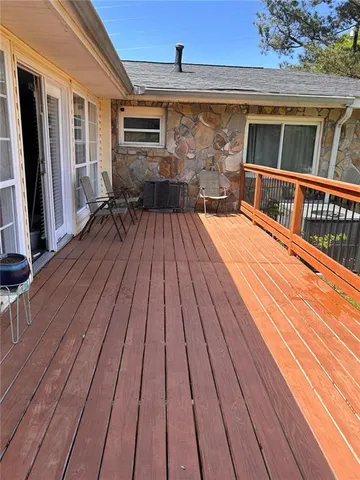 a view of a house with backyard and porch