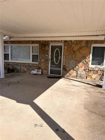 a front view of a house with a glass door