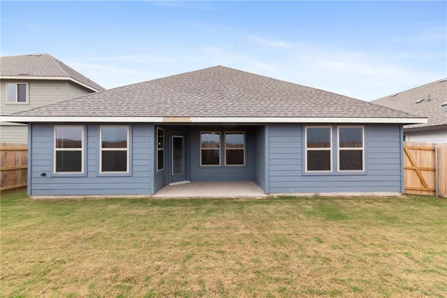 a house that has a big yard in front of it