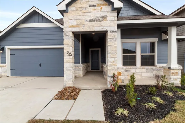 a view of a house with a door and a window