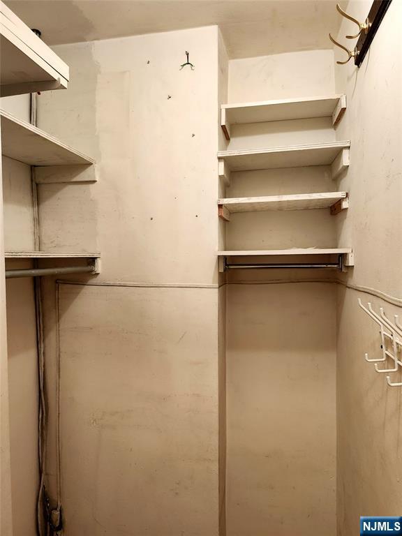 6600 Boulevard East, Unit 8A West New York, NJ 07093 - Photo 18 of 24 a view of walk in closet with empty racks
