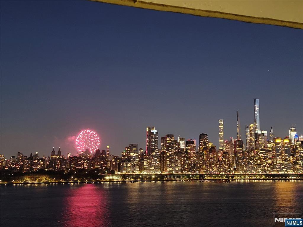 6600 Boulevard East, Unit 8A West New York, NJ 07093 - Photo 22 of 24 a view of a balcony with dining table and chairs