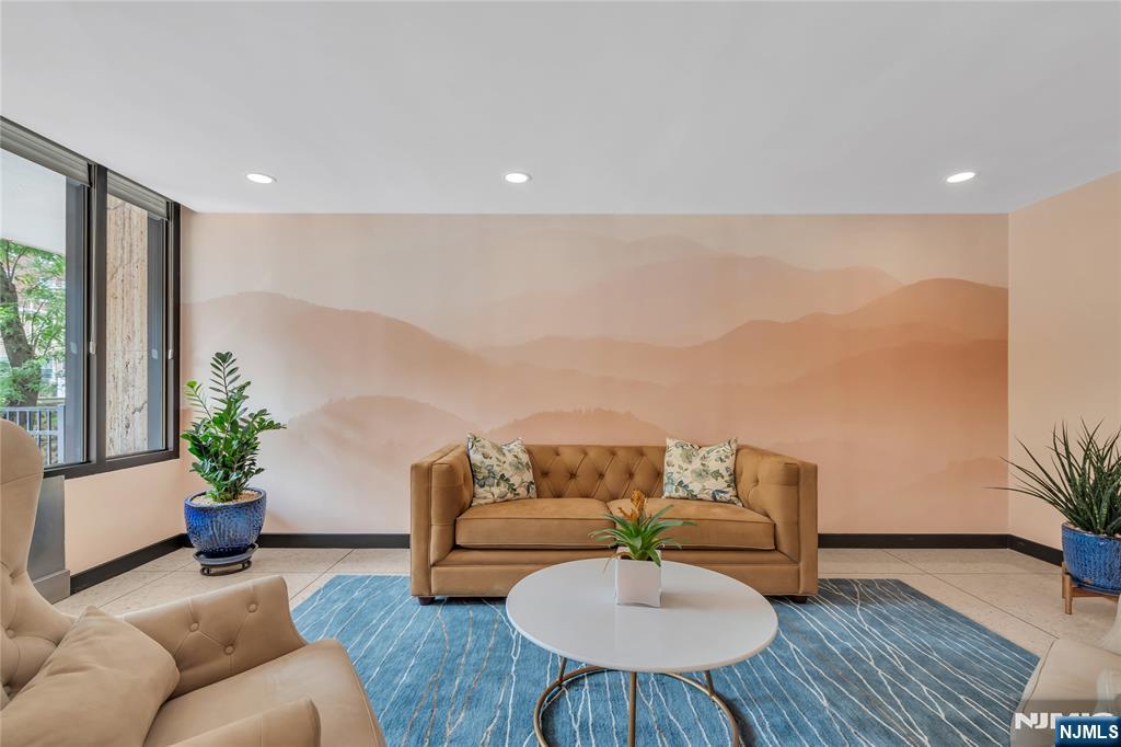 6600 Boulevard East, Unit 8A West New York, NJ 07093 - Photo 3 of 24 a living room with furniture and wooden floor
