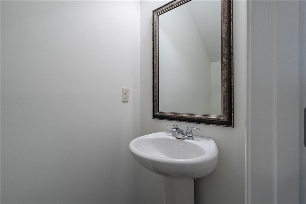3207 Cyrus Point Lane Kennesaw, GA 30152 - Photo 13 of 24 a bathroom with a sink and a mirror