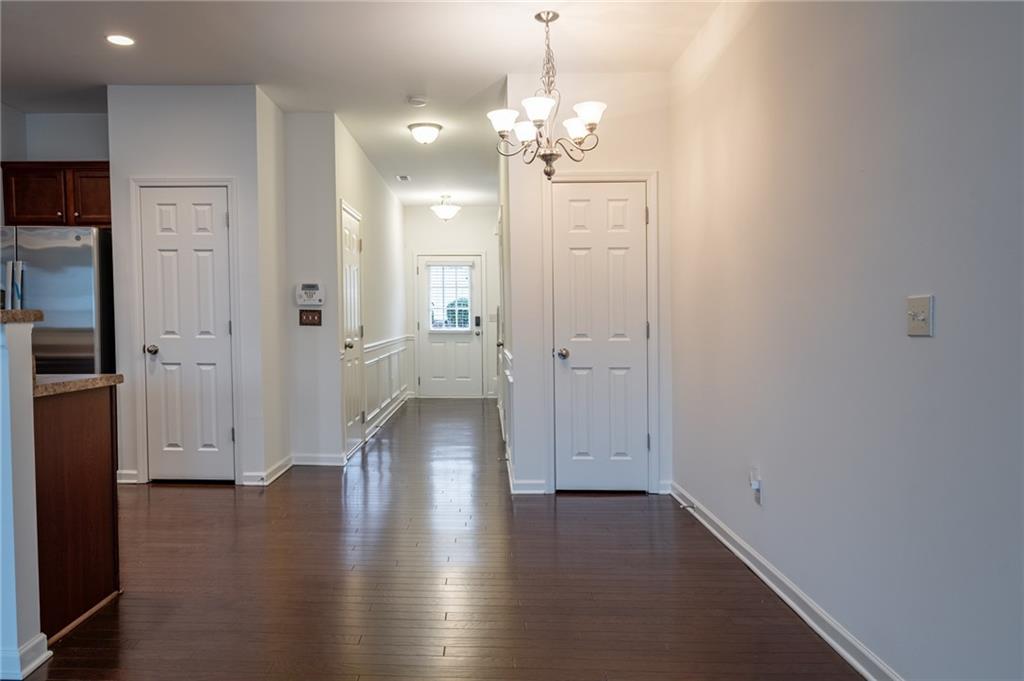 3207 Cyrus Point Lane Kennesaw, GA 30152 - Photo 14 of 24 a view of a hallway with wooden floor