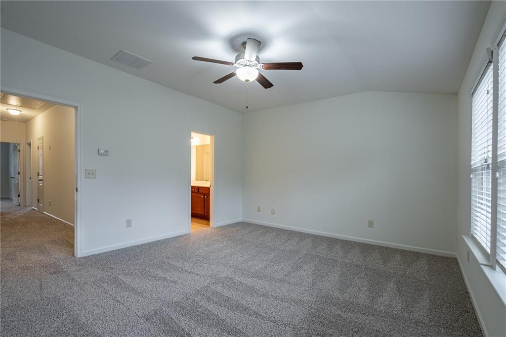 3207 Cyrus Point Lane Kennesaw, GA 30152 - Photo 15 of 24 an empty room with windows and fan