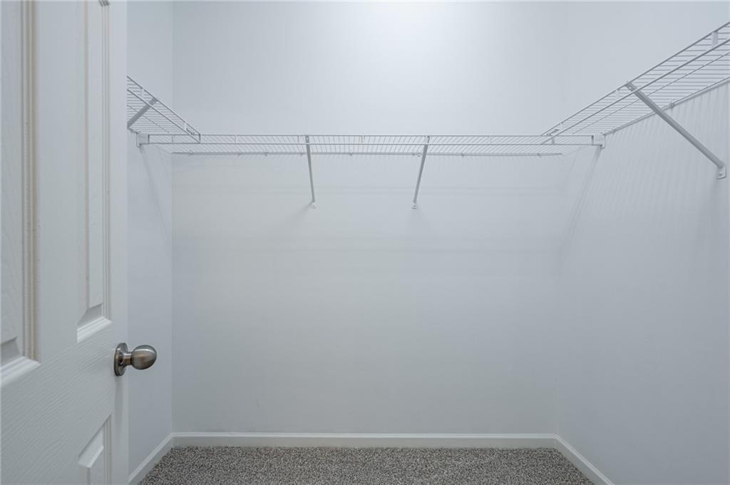 3207 Cyrus Point Lane Kennesaw, GA 30152 - Photo 16 of 24 a view of a room with racks on the wall