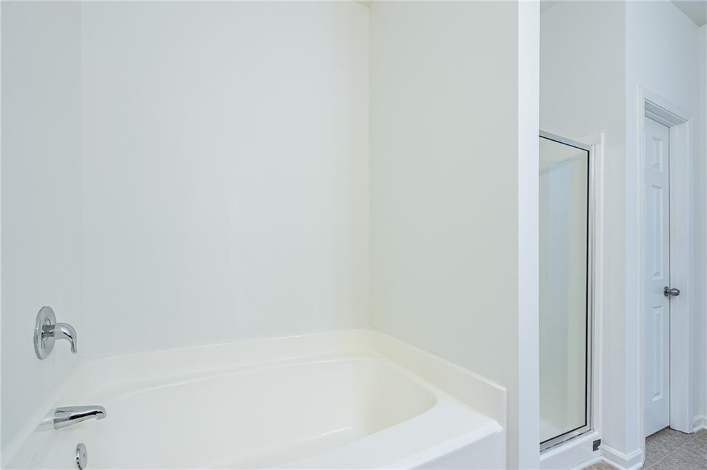 3207 Cyrus Point Lane Kennesaw, GA 30152 - Photo 17 of 24 a close up of a bathtub