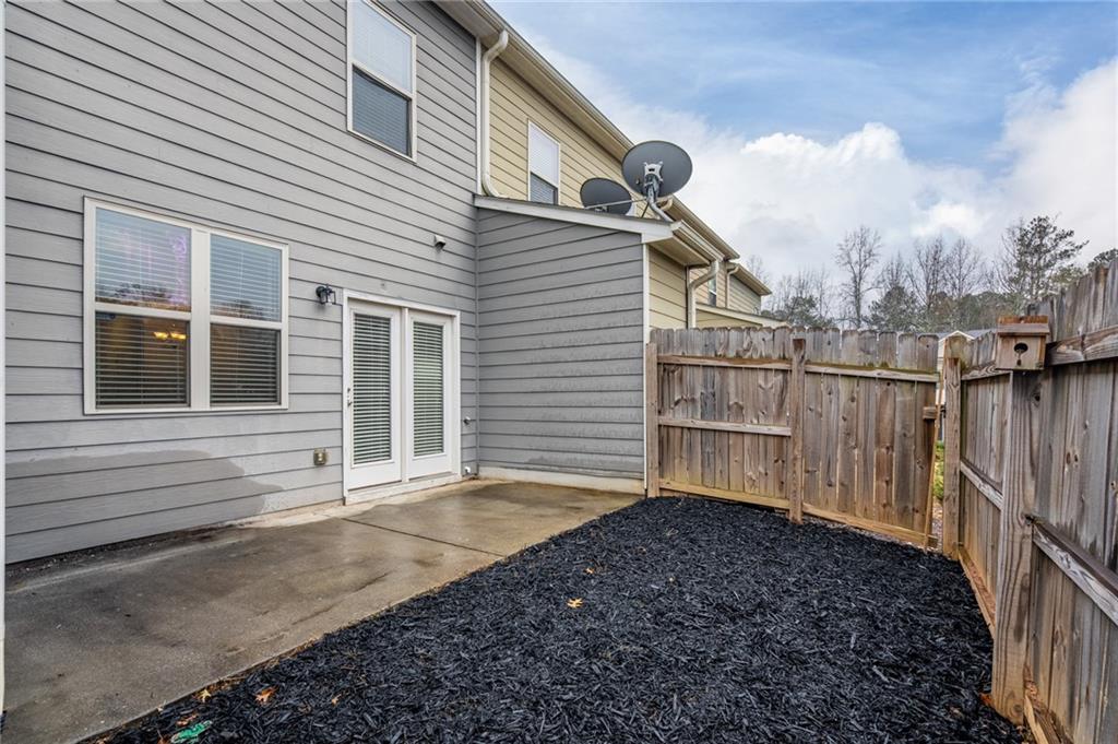 3207 Cyrus Point Lane Kennesaw, GA 30152 - Photo 23 of 24 a view of a house with wooden fence