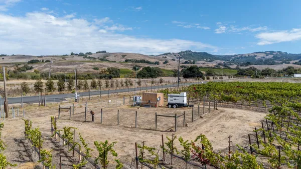 a blue bench sitting in the middle of a building