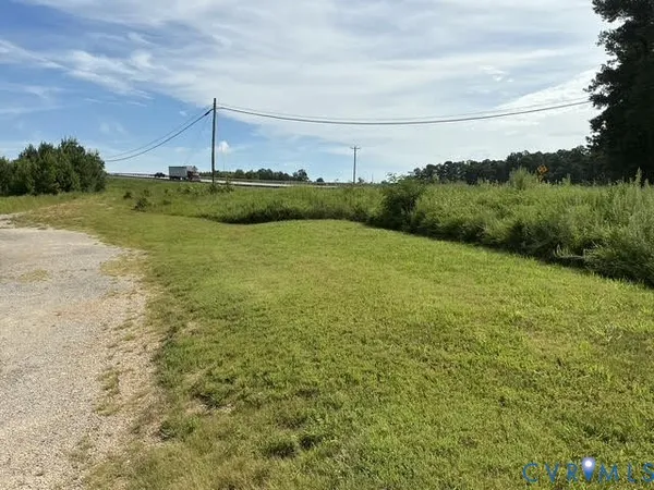 a view of a field with an ocean
