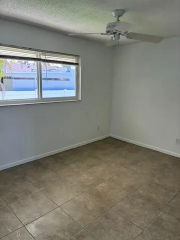 an empty room with closet area