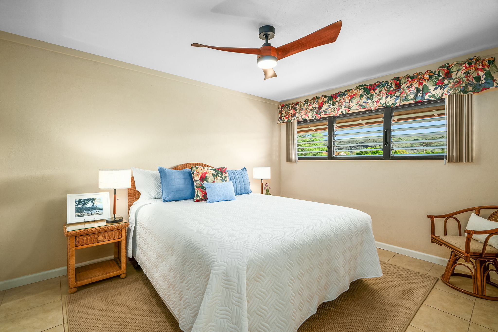 4451 Moana Road, Unit 309 Waimea, HI 96796 - Photo 16 of 21 a bedroom with a bed and a chandelier