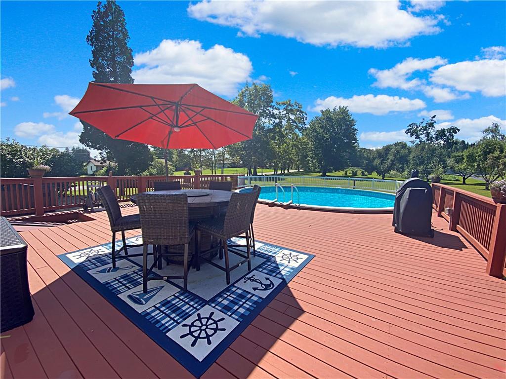 555 West Cornell Road Mercer, PA 16137 - Photo 8 of 25 an outdoor sitting area with furniture and umbrella