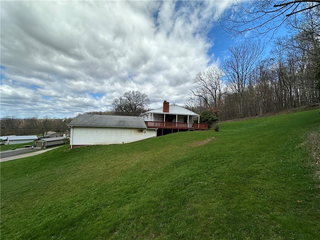 102 Schall Road Kittanning, PA 16201 - Photo 30 of 30 a view of a garden with a house in the background