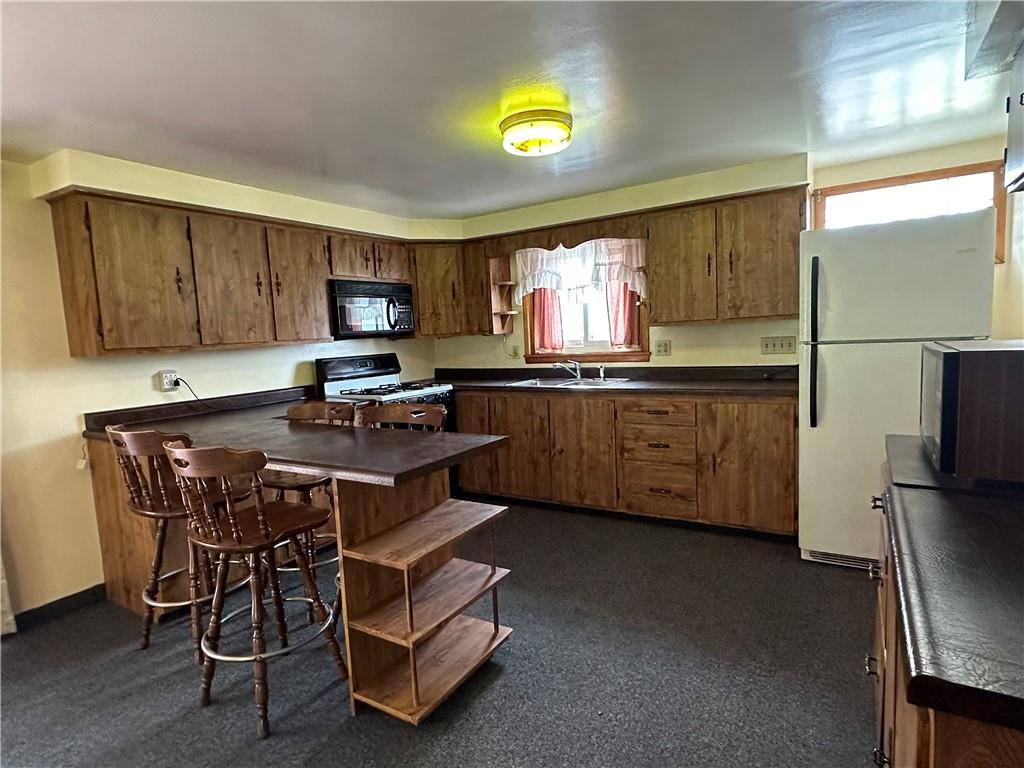 102 Schall Road Kittanning, PA 16201 - Photo 5 of 30 a kitchen with a sink appliances and cabinets