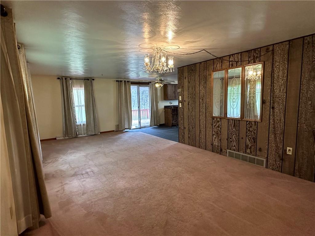 102 Schall Road Kittanning, PA 16201 - Photo 6 of 30 an empty room with stairs and wooden floor