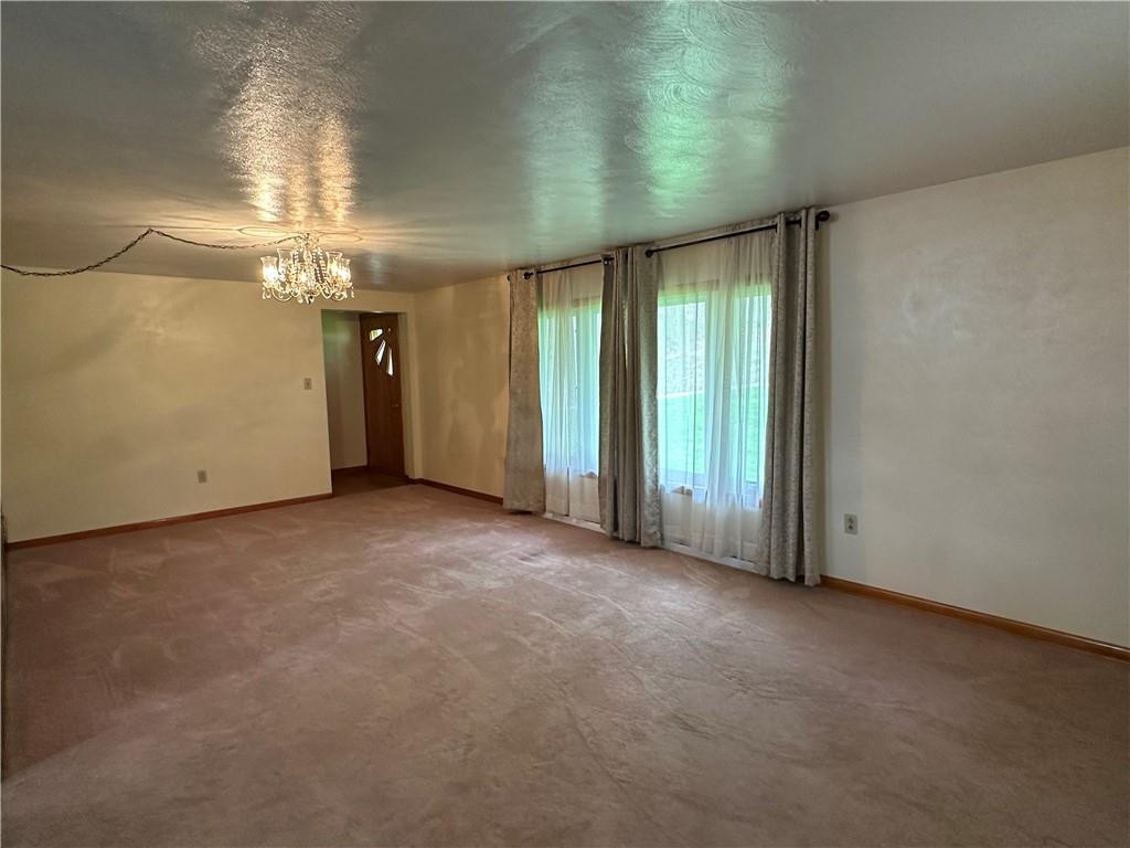 102 Schall Road Kittanning, PA 16201 - Photo 7 of 30 an empty room with windows and entrance