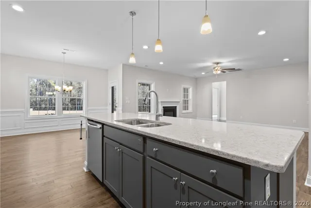 a bathroom with a shower sink and mirror
