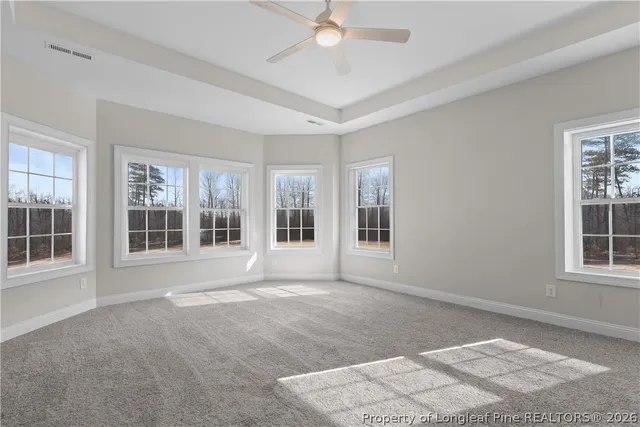 a bedroom with a bed chair and a window