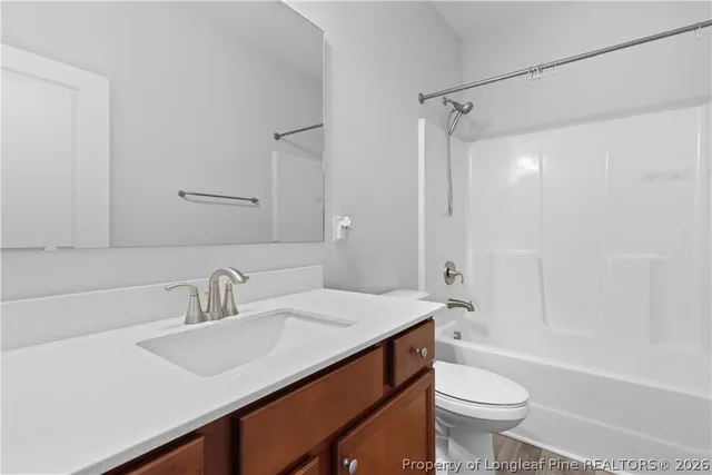 a aerial view of a house next to a yard with potted plants