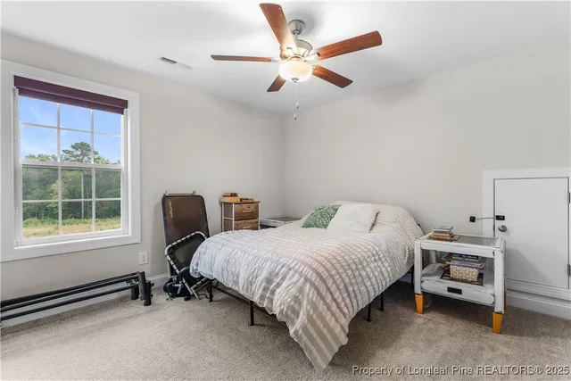 an aerial view of a house with a garden and swimming pool