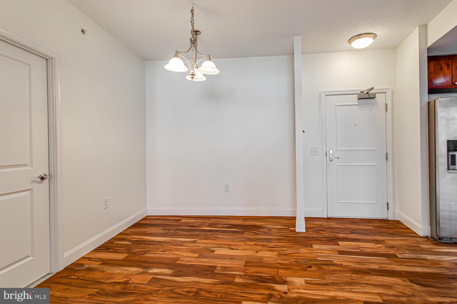 3650 South Glebe Road, Unit 239 Arlington, VA 22202 - Photo 9 of 38 a view of empty room with wooden floor