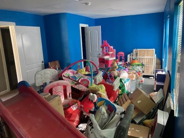 2434 South 9th Street Waco, TX 76706 - Photo 9 of 16 a room with furniture toys and a flat screen tv