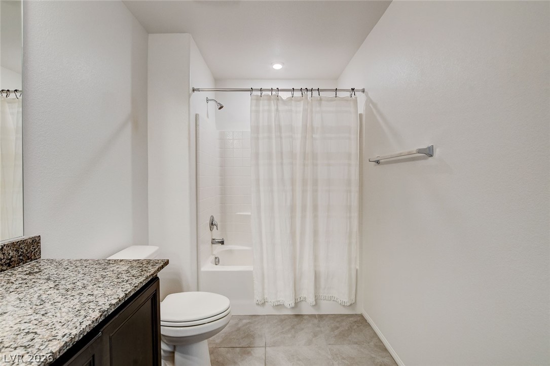 484 Filaree Place Henderson, NV 89015 - Photo 40 of 71 Bright and clean bathroom features a spacious shower and elegant granite countertops.
