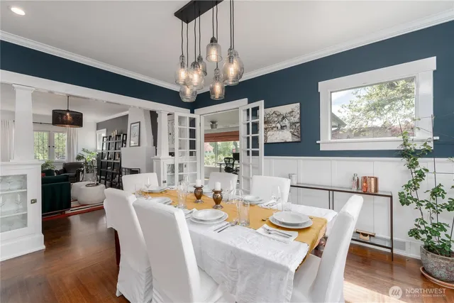 a view of a dining room with furniture window and wooden floor