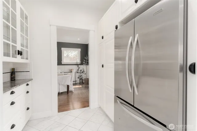 a bathroom with a shower and a sink