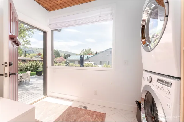 a view of a hallway with washer and dryer