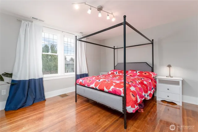 a view of a chair and table in backyard of the house