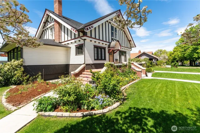 a front view of a house with garden