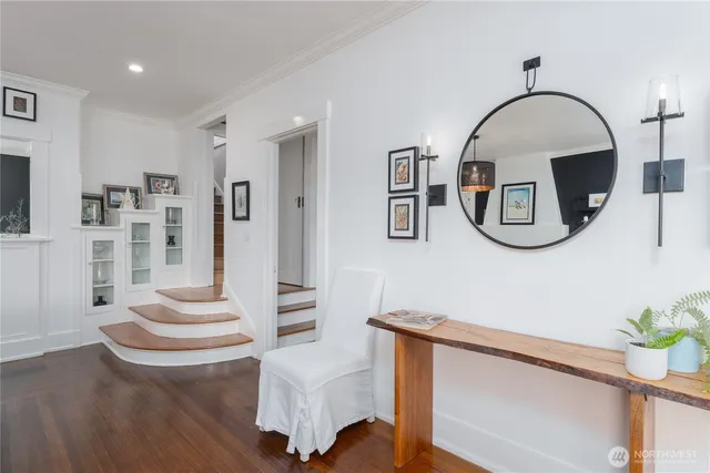 a front view of a house with entryway and wooden floor